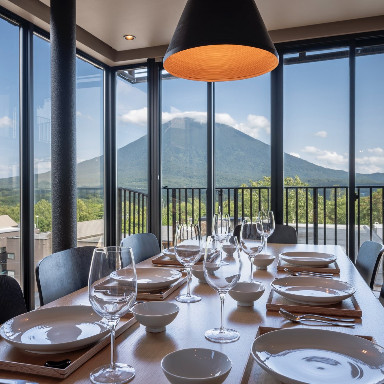 Fresh Hokkaido summer produce served at a Niseko restaurant, featuring seasonal dishes with scenic mountain views and a relaxing onsen-inspired atmosphere.