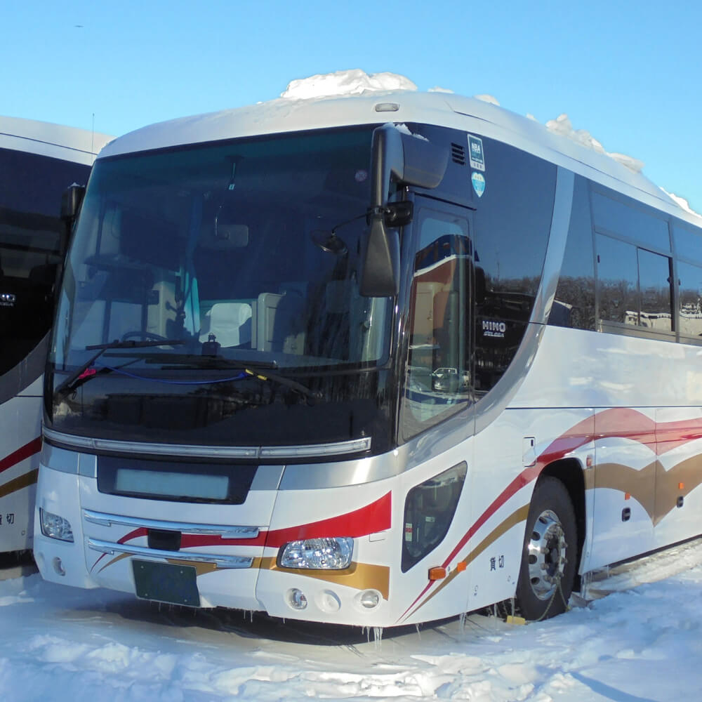 Bus transfer from New Chitose Airport to Niseko through snowy Hokkaido scenery